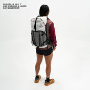 Left side view of Hyperlite Mountain Gear's Windrider 70 Pack in White on model