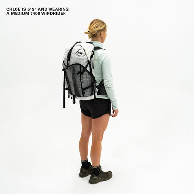 Left side view of Hyperlite Mountain Gear's Windrider 70 Pack in White on model