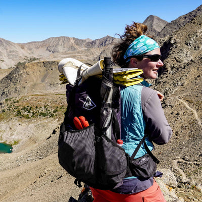 Female wearing the Southwest 55 backpack draped over her shoulders